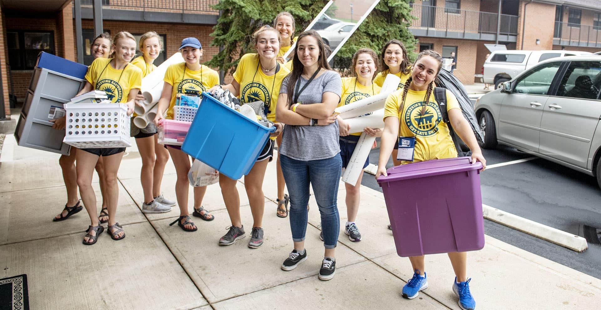 College students moving new student into Printy residence hall